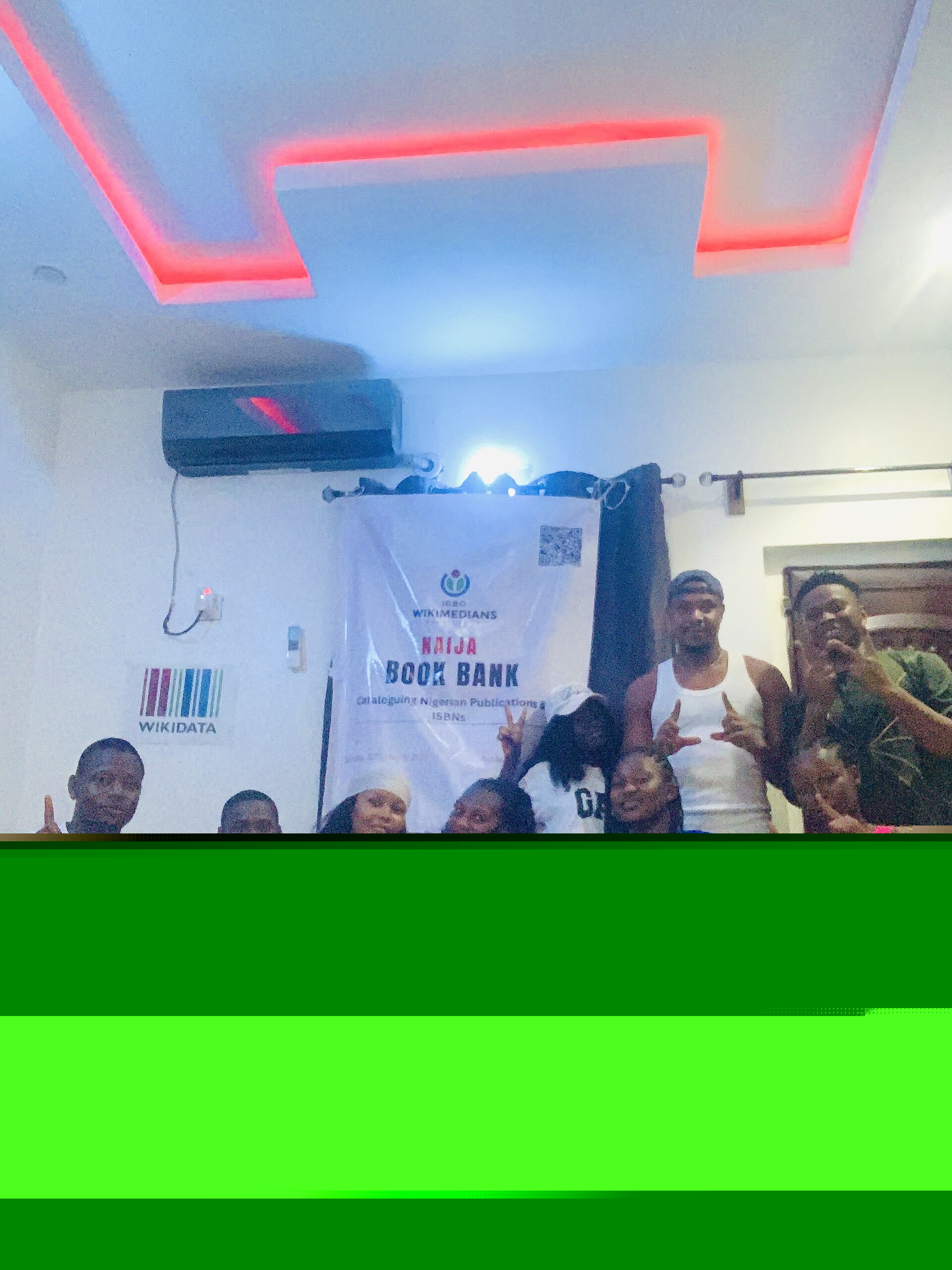 People taking a group photograph at the Naija Book Bank event
